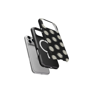 Phone cases with polka dot design and clear back on a white background