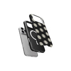 Phone cases with polka dot design and clear back on a white background